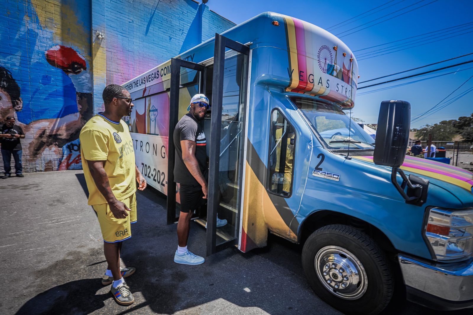 Men gathered by Vegas Stronger outreach bus