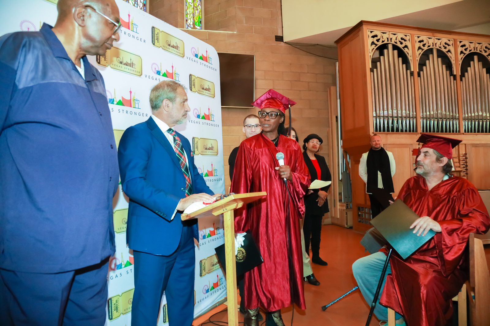 Group and seated graduates at Vegas Stronger ceremony