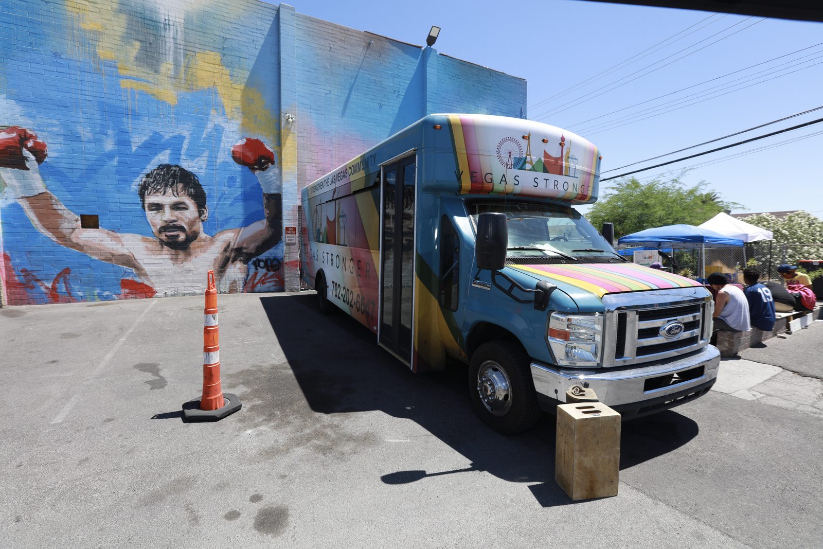 Vegas Stronger outreach bus parked by mural