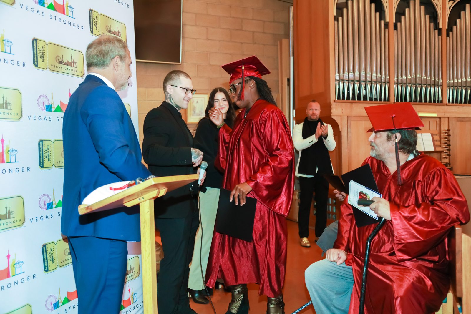 Graduate speaks at Vegas Stronger recovery ceremony podium