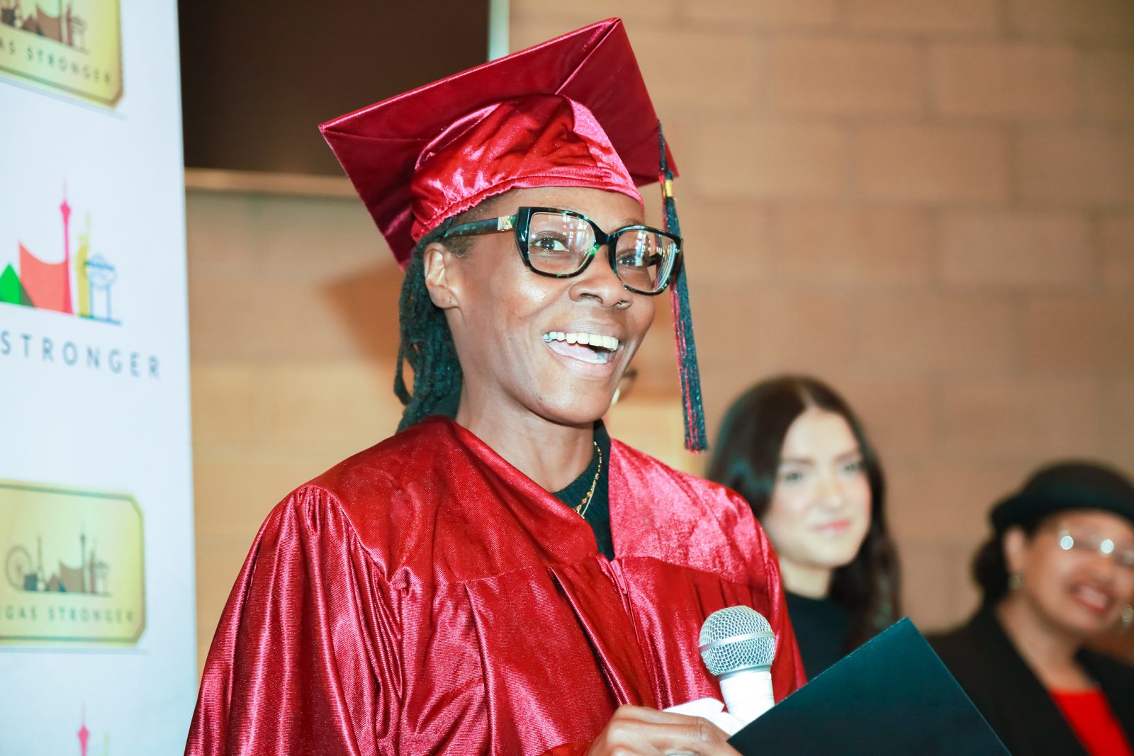 Presenter applauds graduate at Vegas Stronger ceremony