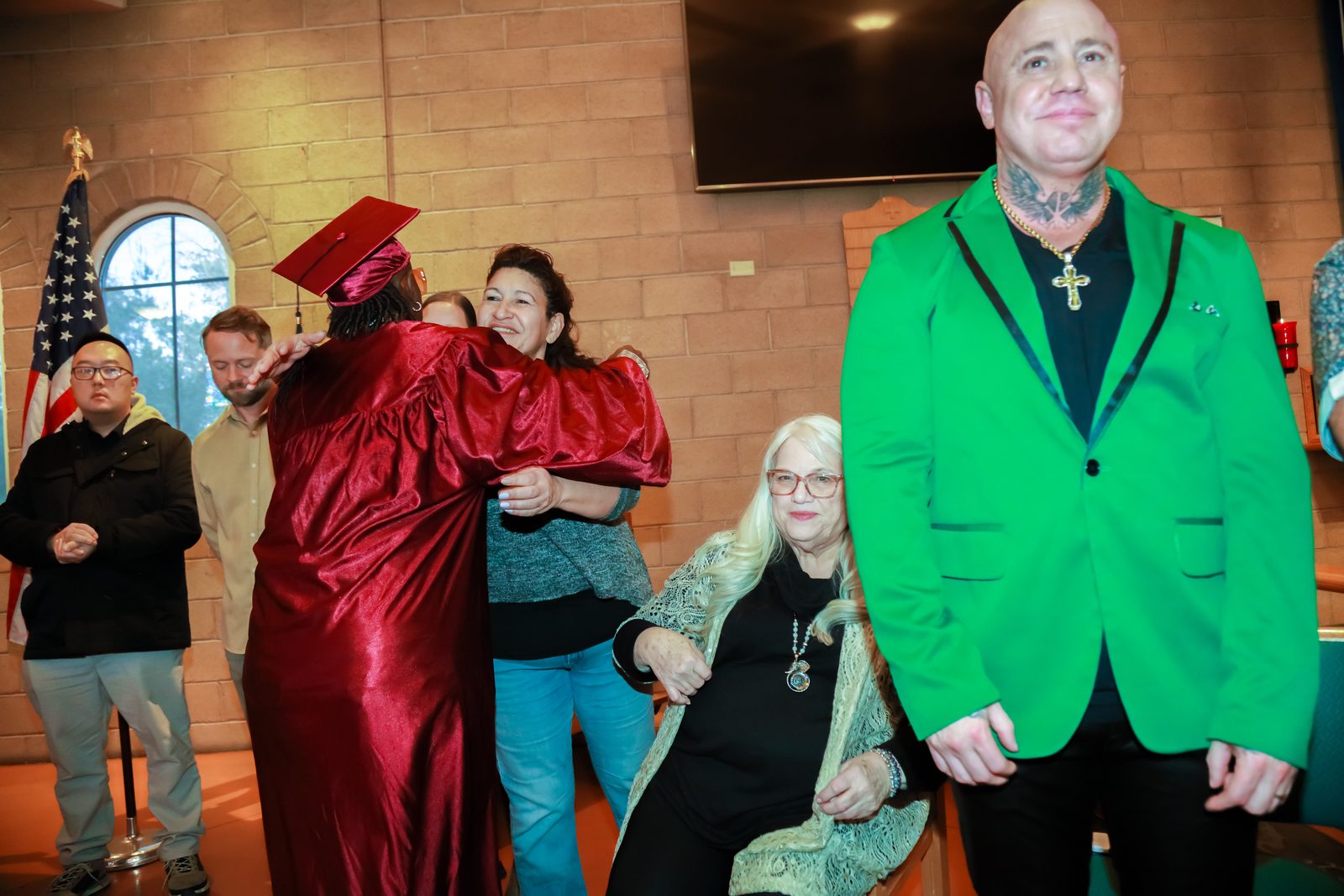 Graduation embrace at Las Vegas community ceremony