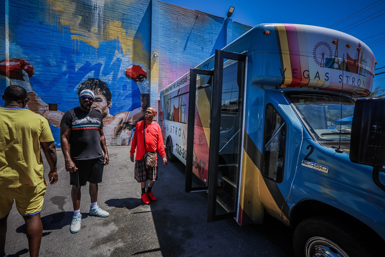 Group near Vegas Stronger bus and mural in Las Vegas