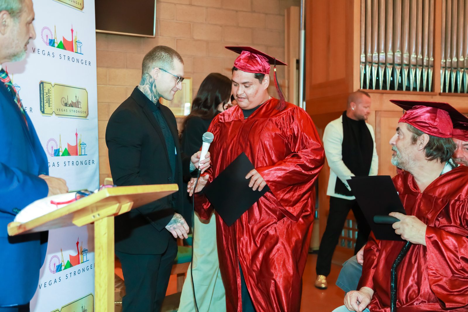 Graduate speaks at Vegas Stronger graduation podium